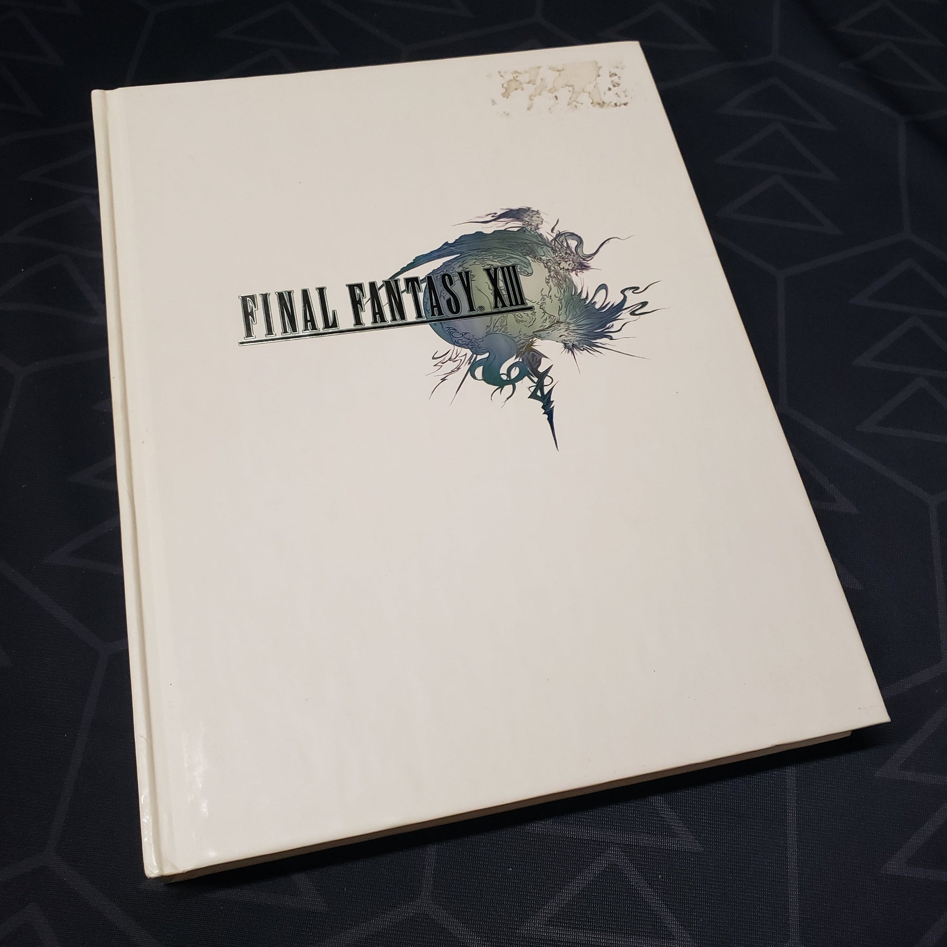 Image shows the front cover of the Final Fantasy XIII: The Complete Official Strategy Guide book