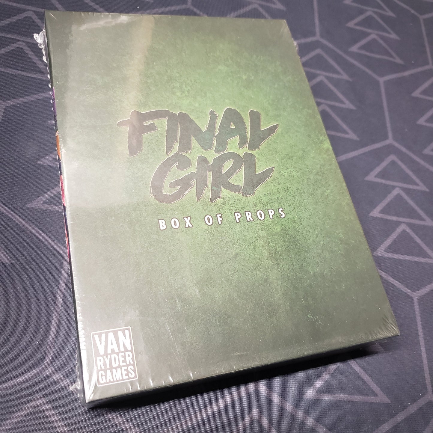 Image shows the front cover of the box of the Box of Props expansion for the board game Final Girl