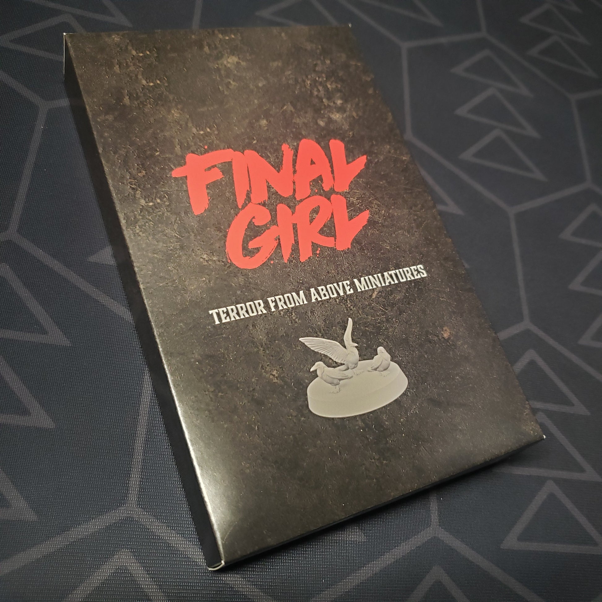 Image shows the front cover of the box of the Terror From Above Miniatures expansion for the board game Final Girl