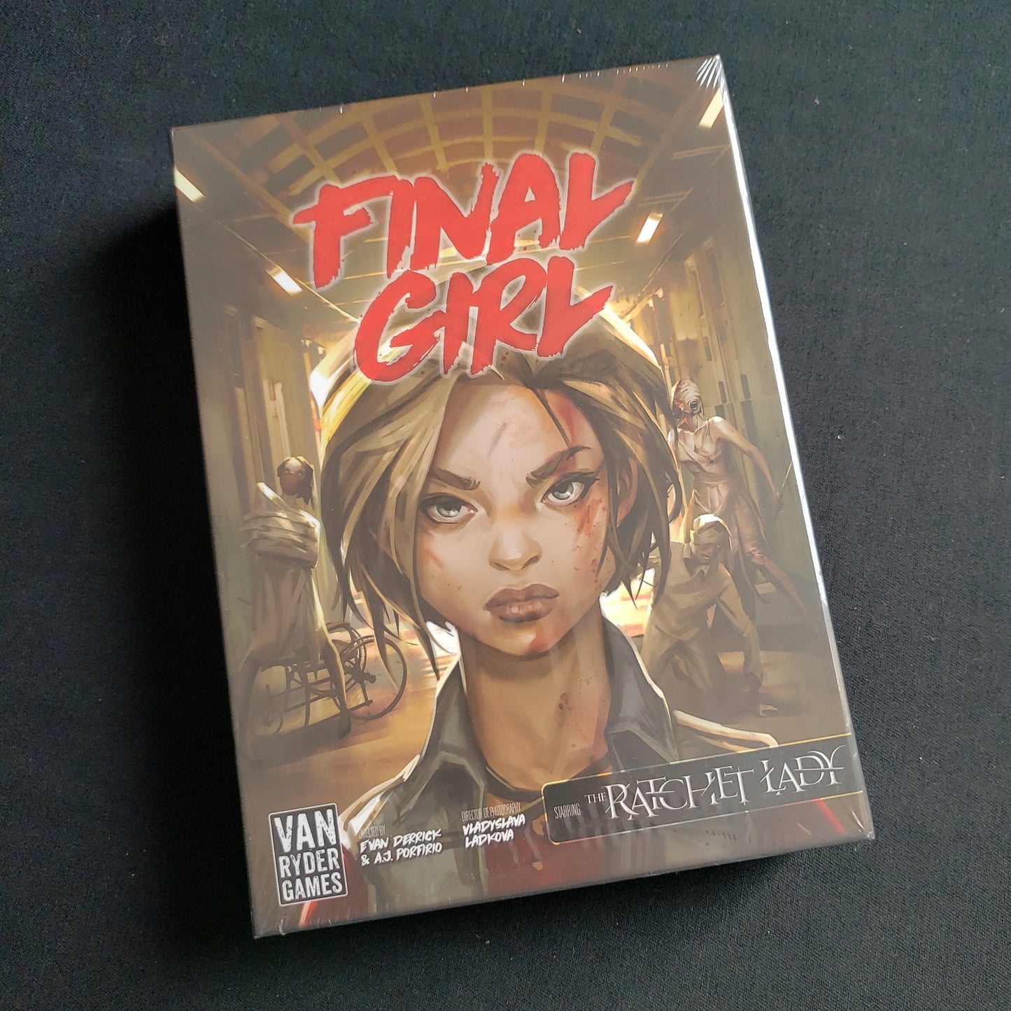 Image shows the front of the box for the Madness in the Dark Feature Film Expansion for the Final Girl board game