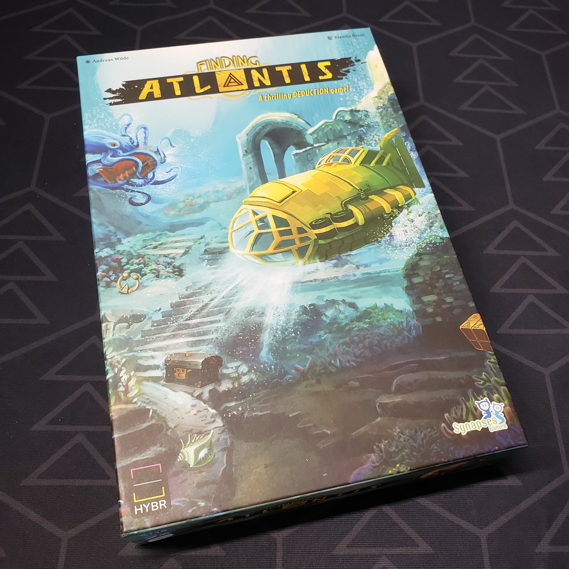 Image shows the front cover of the box for the Finding Atlantis board game