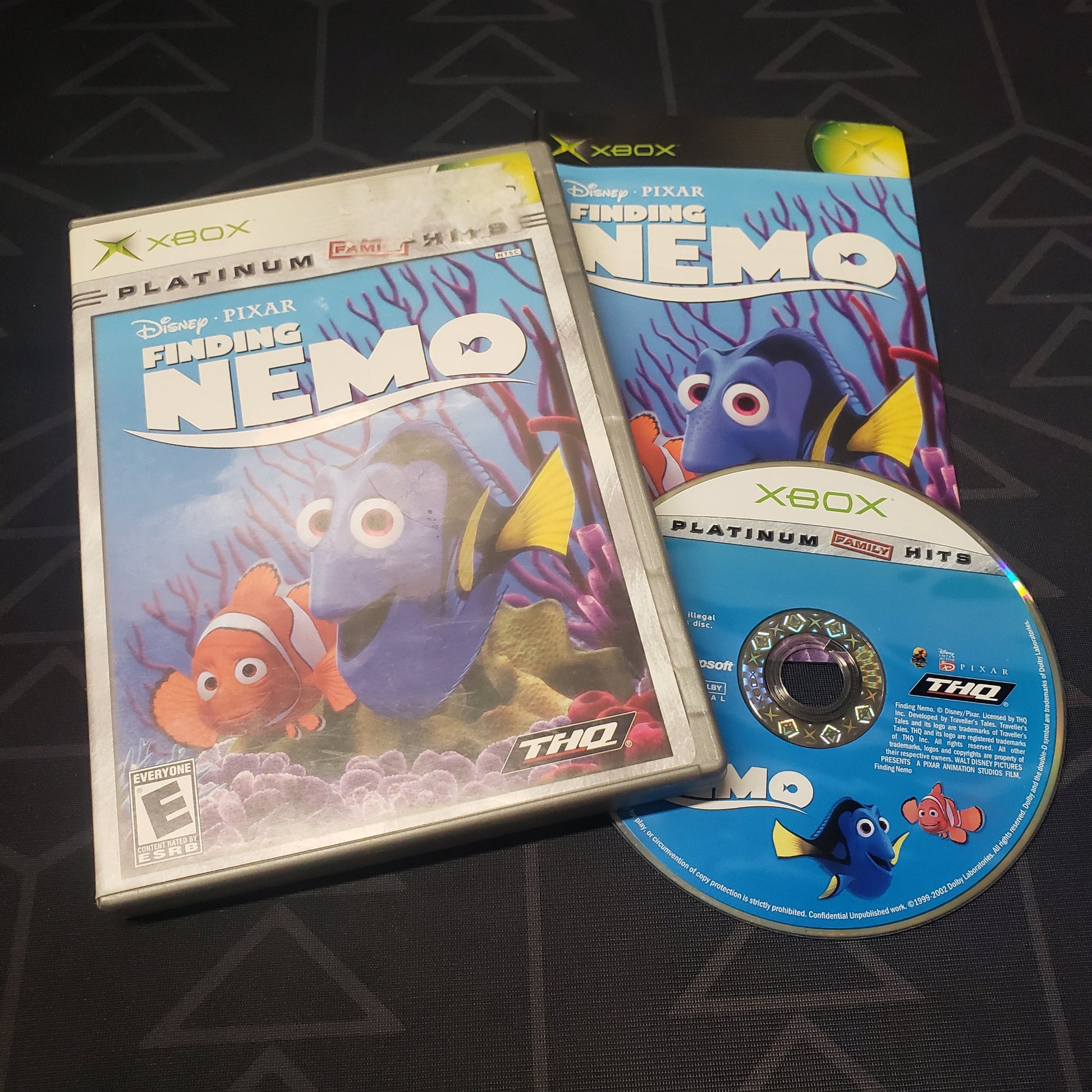 Image shows the case, manual and disc for the video game Finding Nemo for the original Xbox