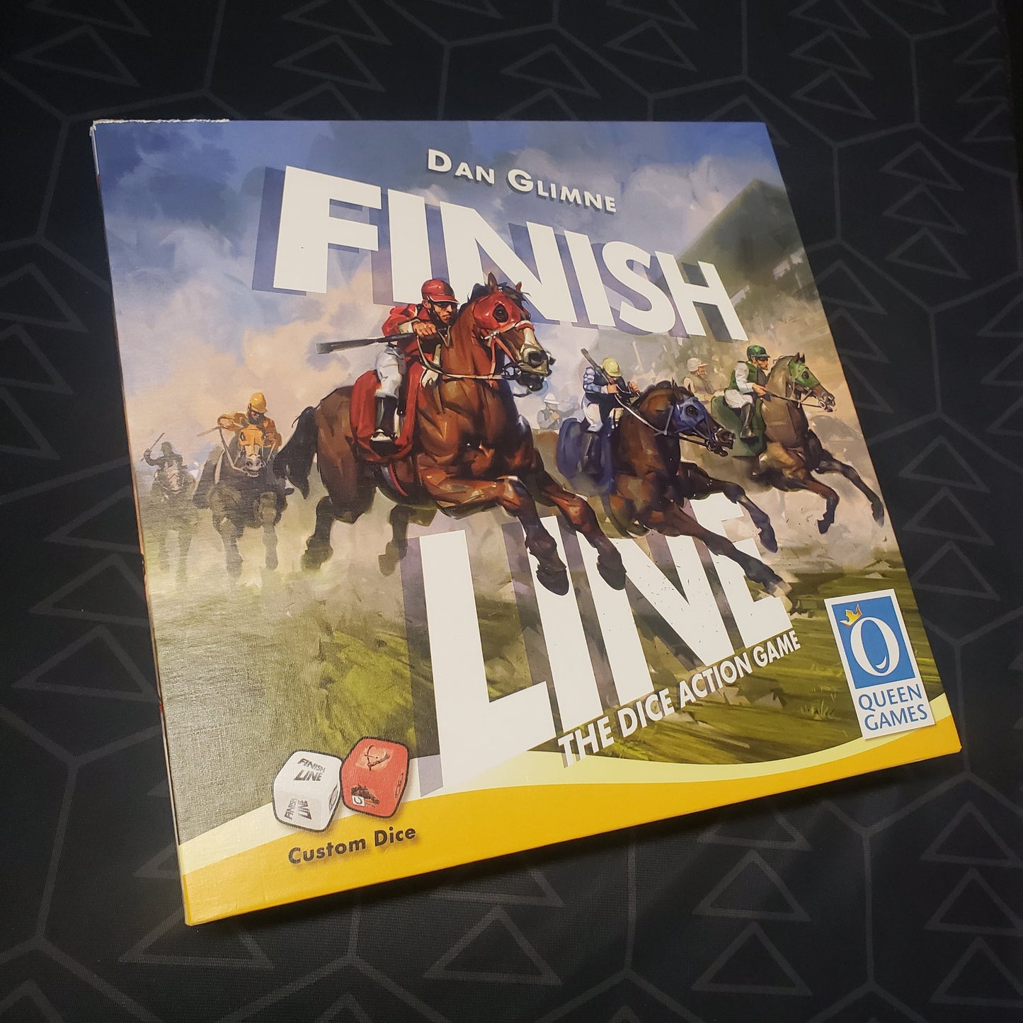 Image shows the front cover of the box for the Finish Line board game