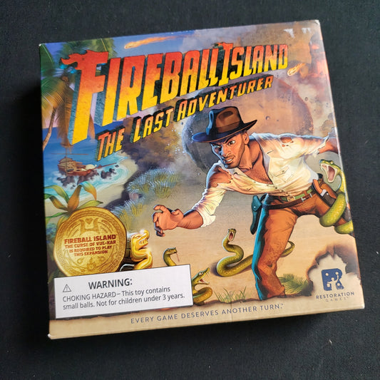Image shows the front cover of the box of the Last Adventurer expansion for the Fireball Island board game