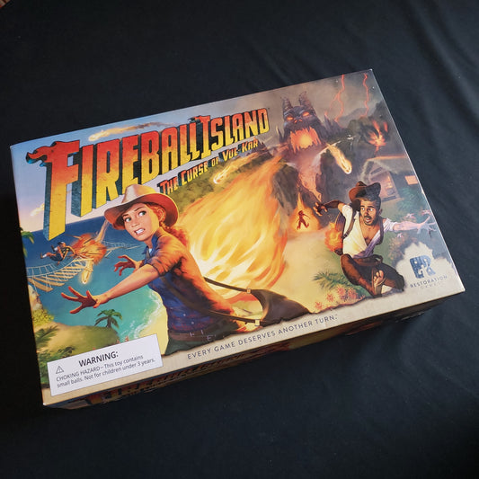 Image shows the front cover of the box of the Fireball Island board game
