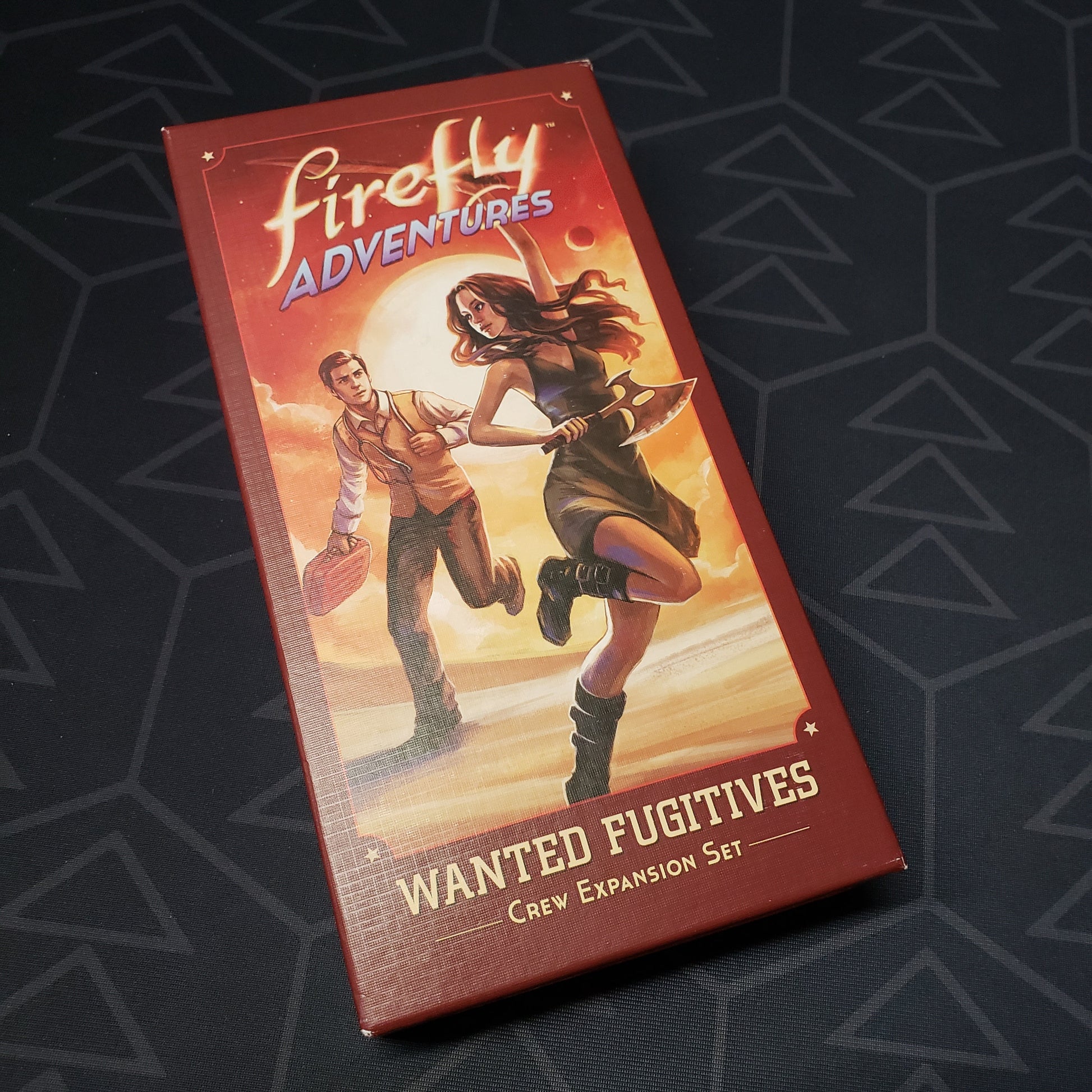 Image shows the front cover of the box of the Wanted Fugitives expansion for the board game Firefly Adventures