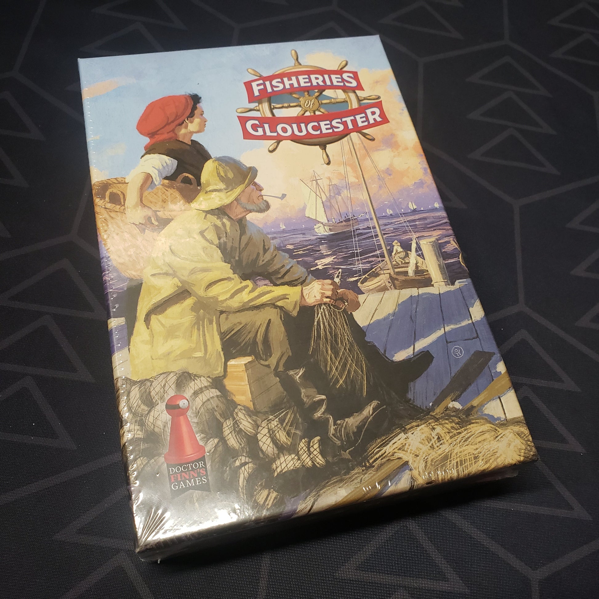 Image shows the front cover of the box for the Fisheries of Gloucester board game