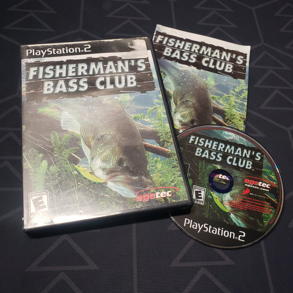 Image shows the case, manual and disc for the video game Fisherman's Bass Club for Playstation 2
