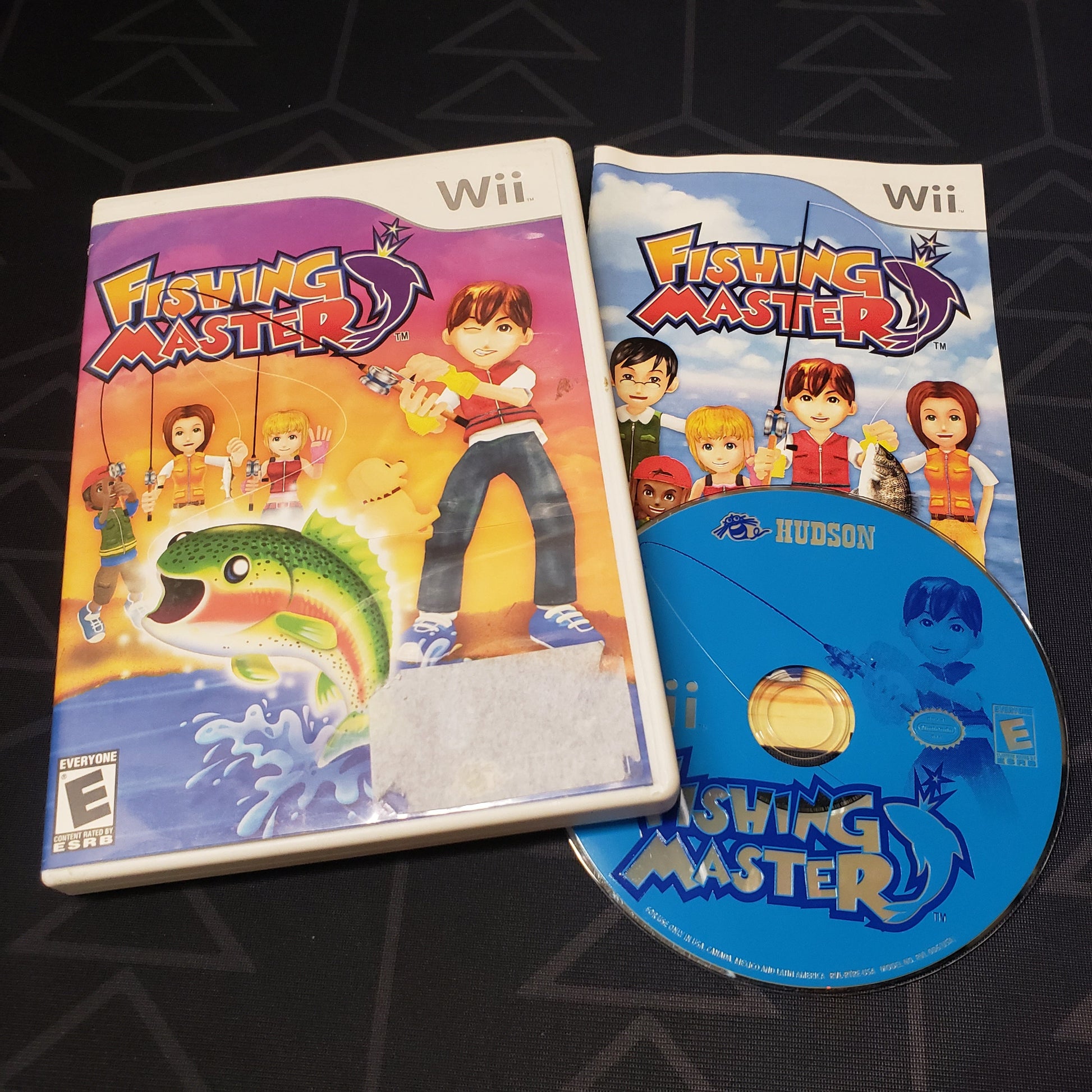 Image shows the case, manual & disc for the video game Fishing Master for Nintendo Wii