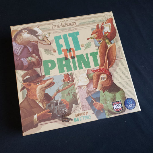 Image shows the front cover of the box of the Fit to Print board game