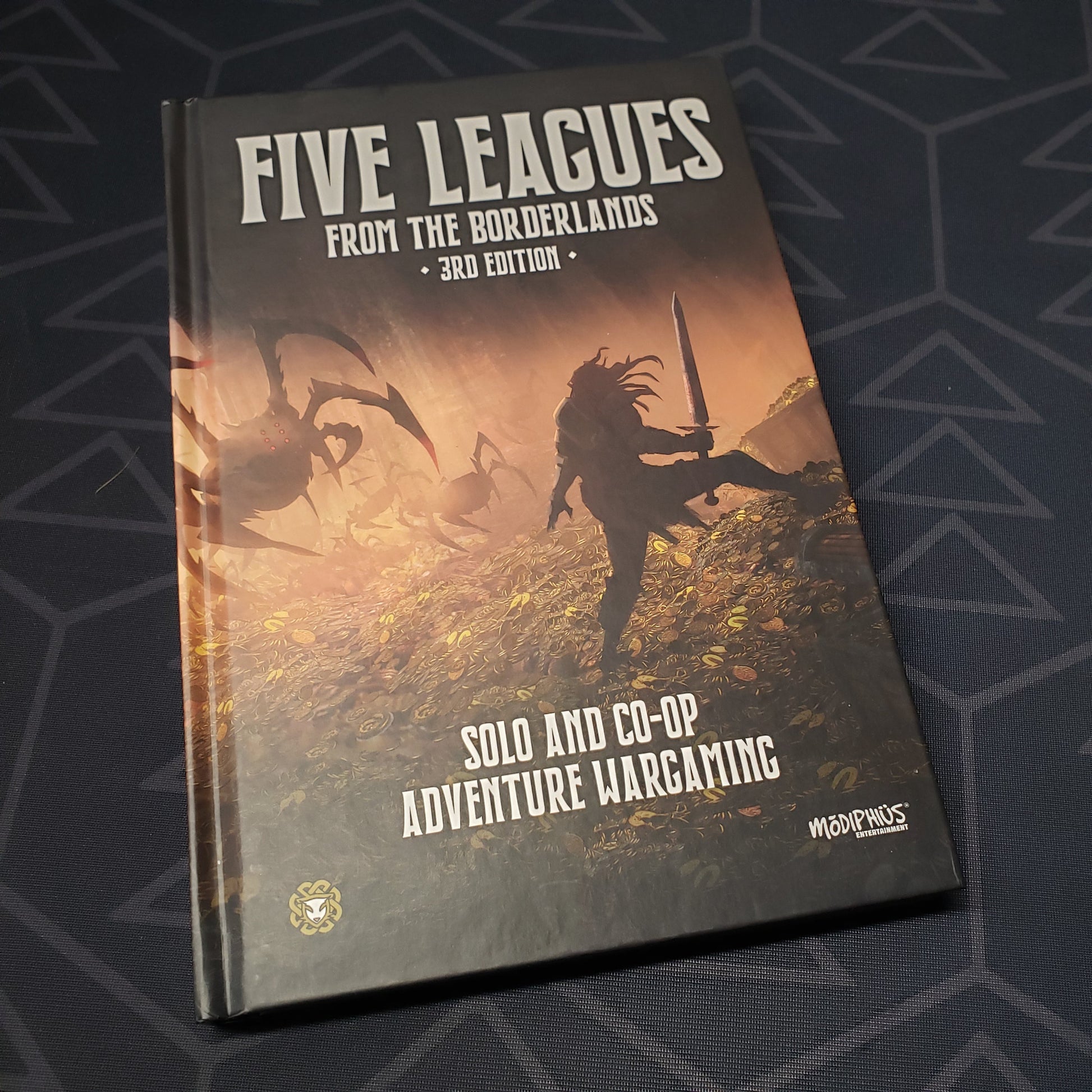 Image shows the front cover of the Five Leagues from the Borderlands gaming book