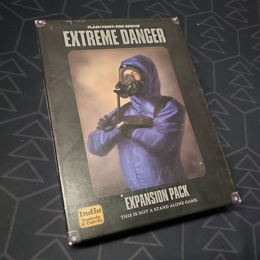 Image shows the front cover of the box of the Extreme Danger expansion for the board game Flash Point: Fire Rescue