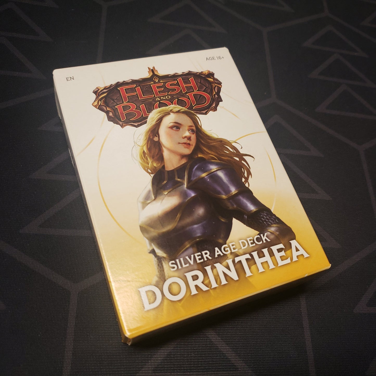 Image shows the front cover of the box of the Silver Age: Dorinthea deck for the card game Flesh & Blood