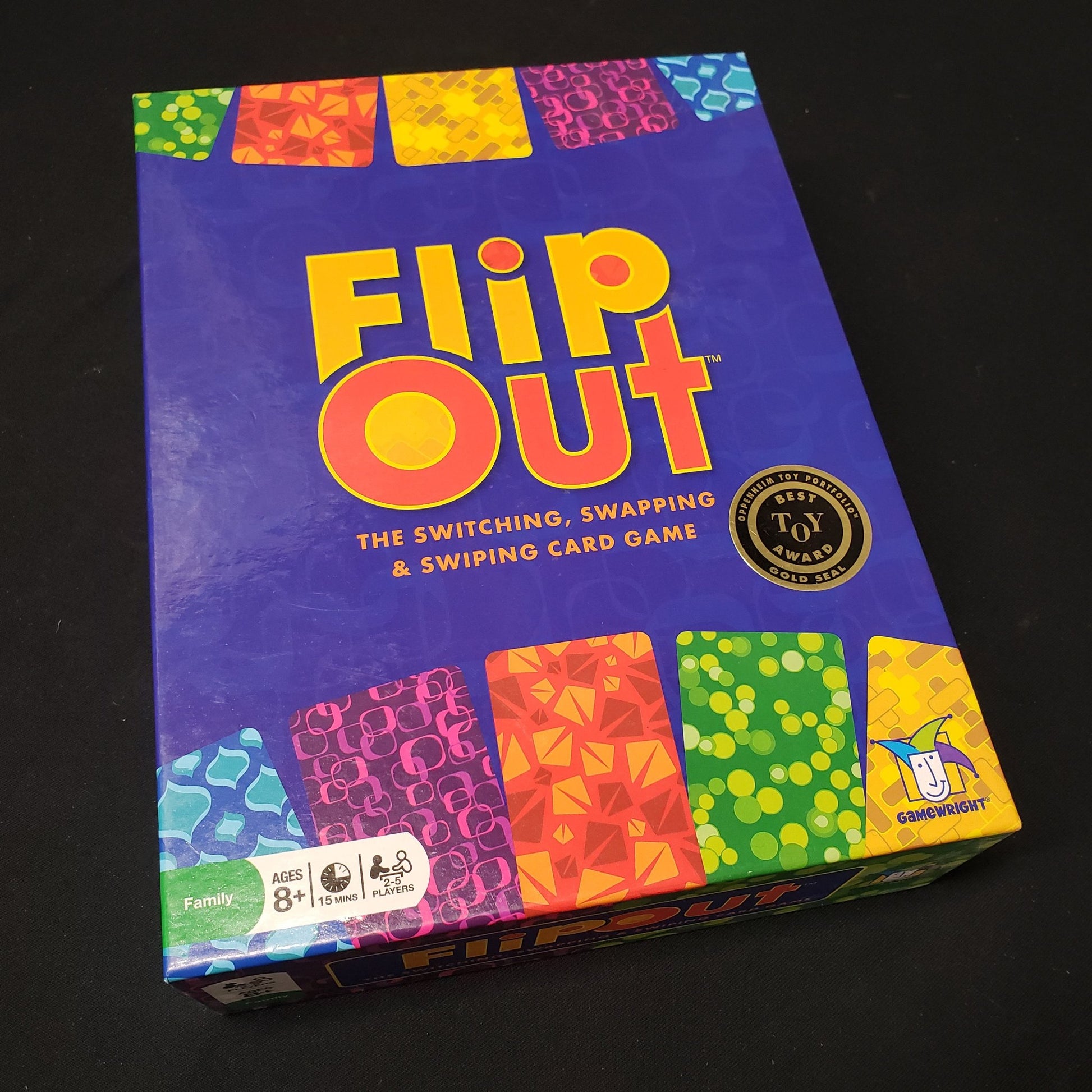 Image shows the front cover of the box of the FlipOut card game