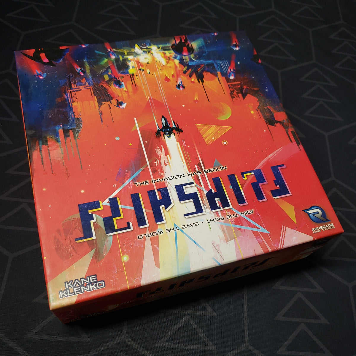 Image shows the front cover of the box for the Flipships board game