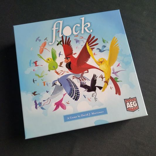 Image shows the front cover of the box of the Flock board game