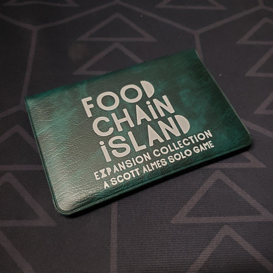 Image shows the front of the card wallet of the Expansion Collection for the card game Food Chain Island