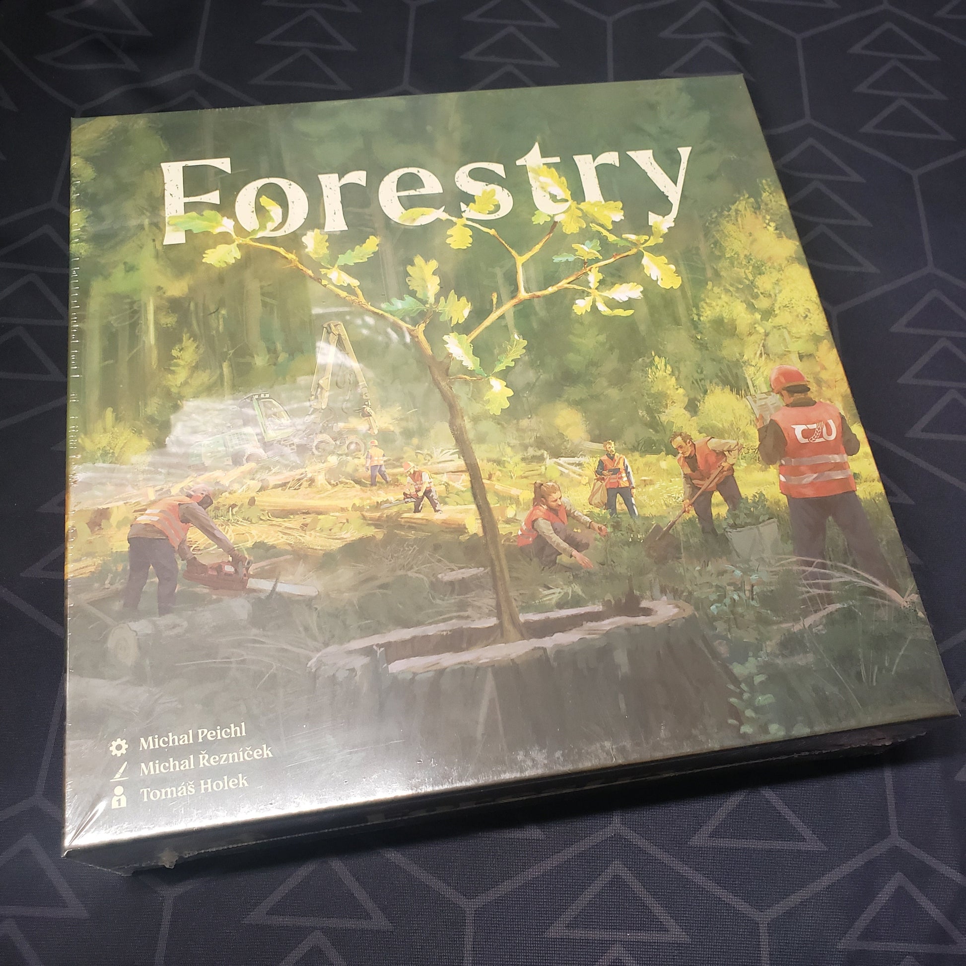 Image shows the front cover of the box for the Forestry board game