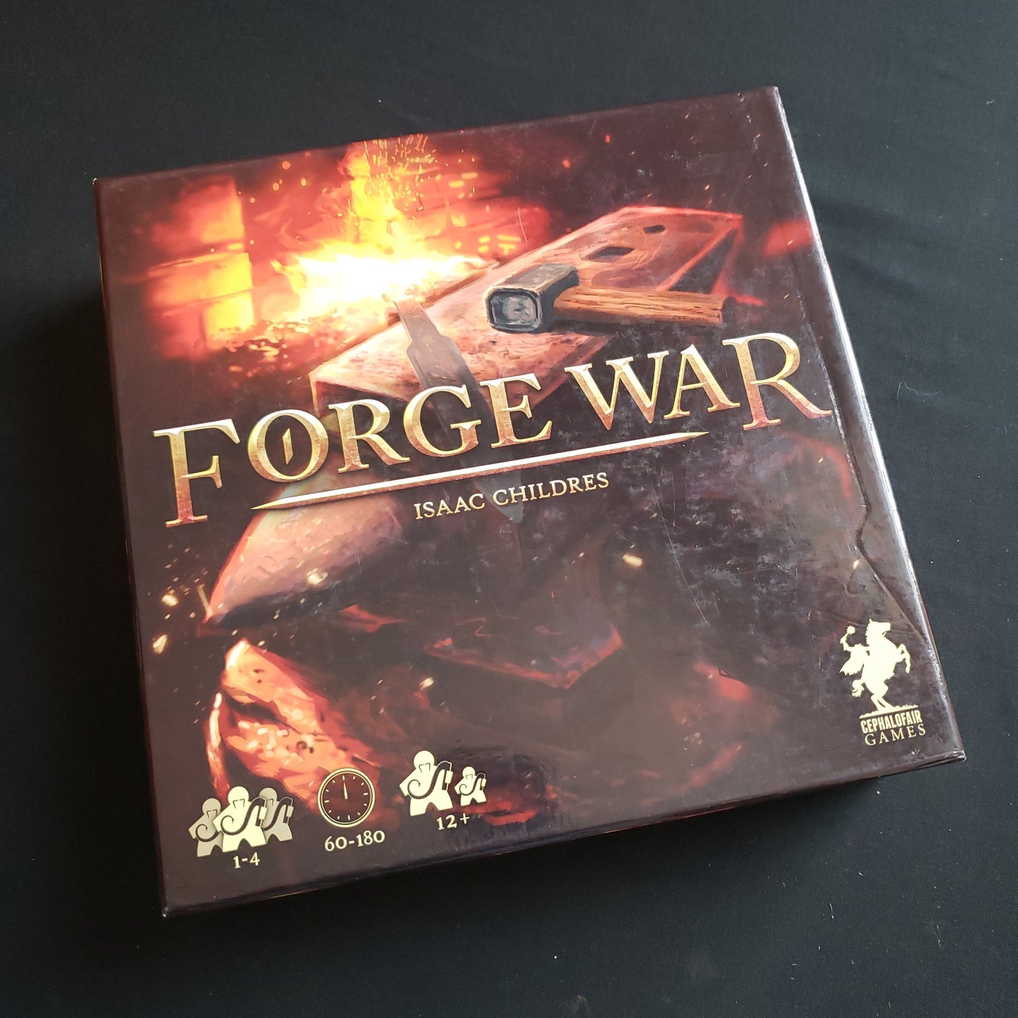 Image shows the front cover of the box of the Forge War board game