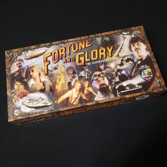 Image shows the front cover of the box of the Fortune & Glory board game