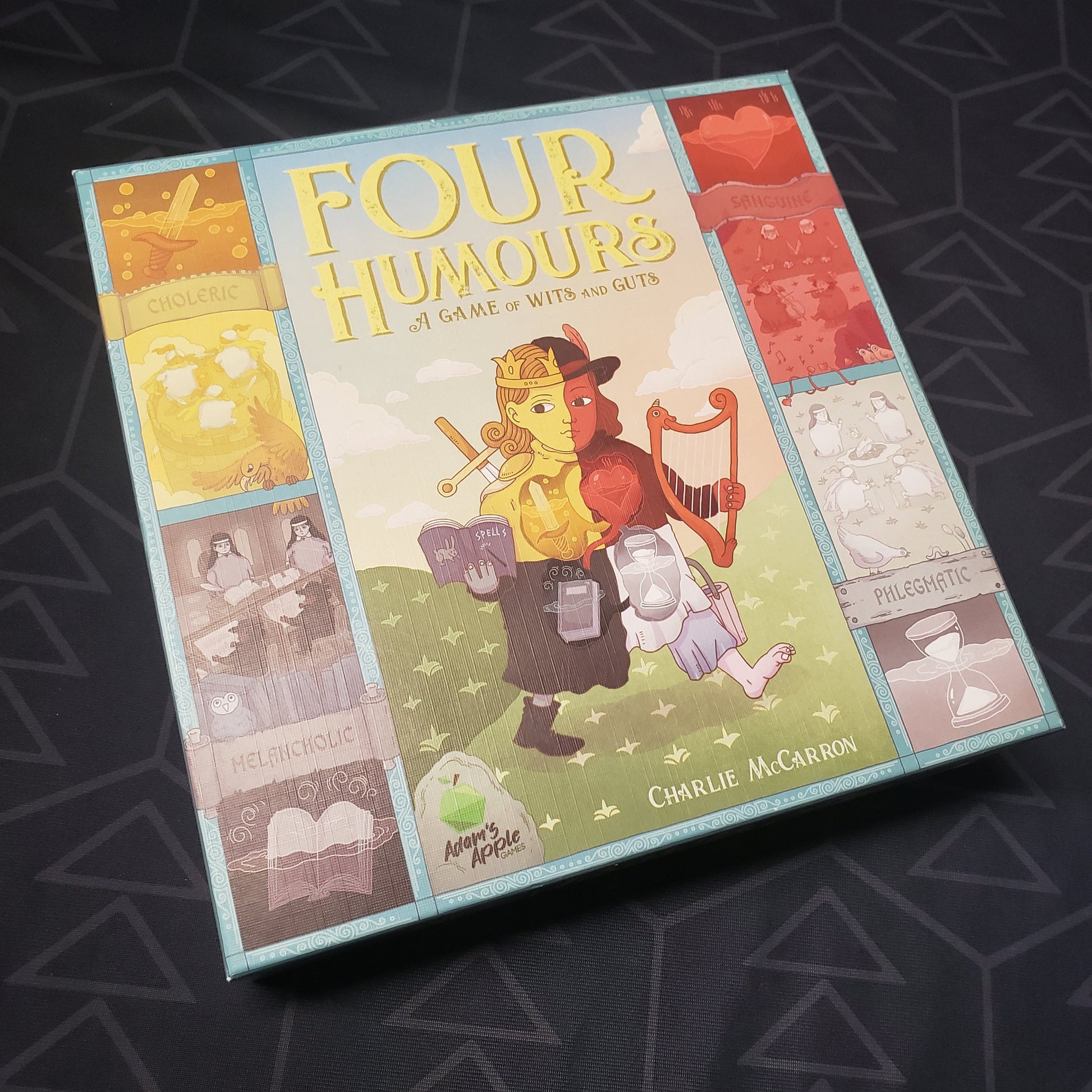 Image shows the front cover of the box of the Four Humours board game