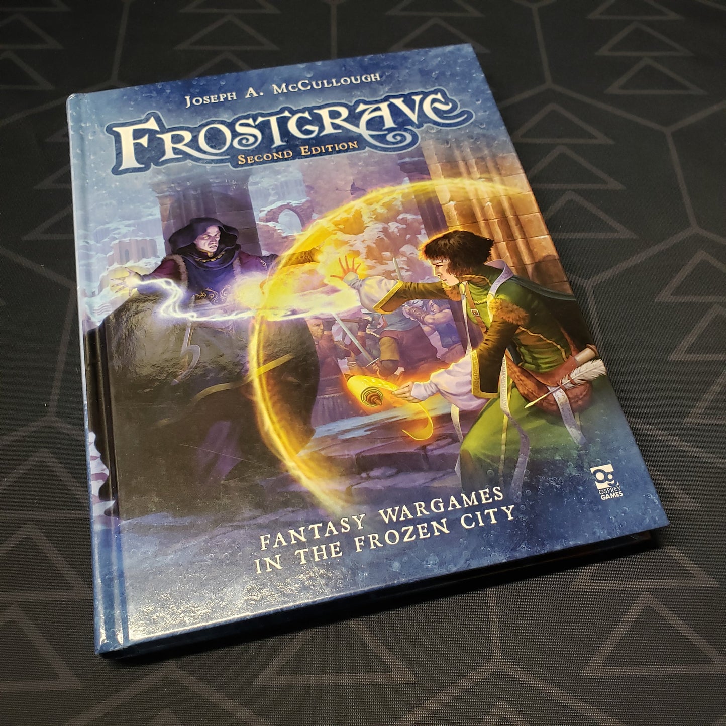Image shows the front cover of the Frostgrave: Second Edition Core Rules gaming book