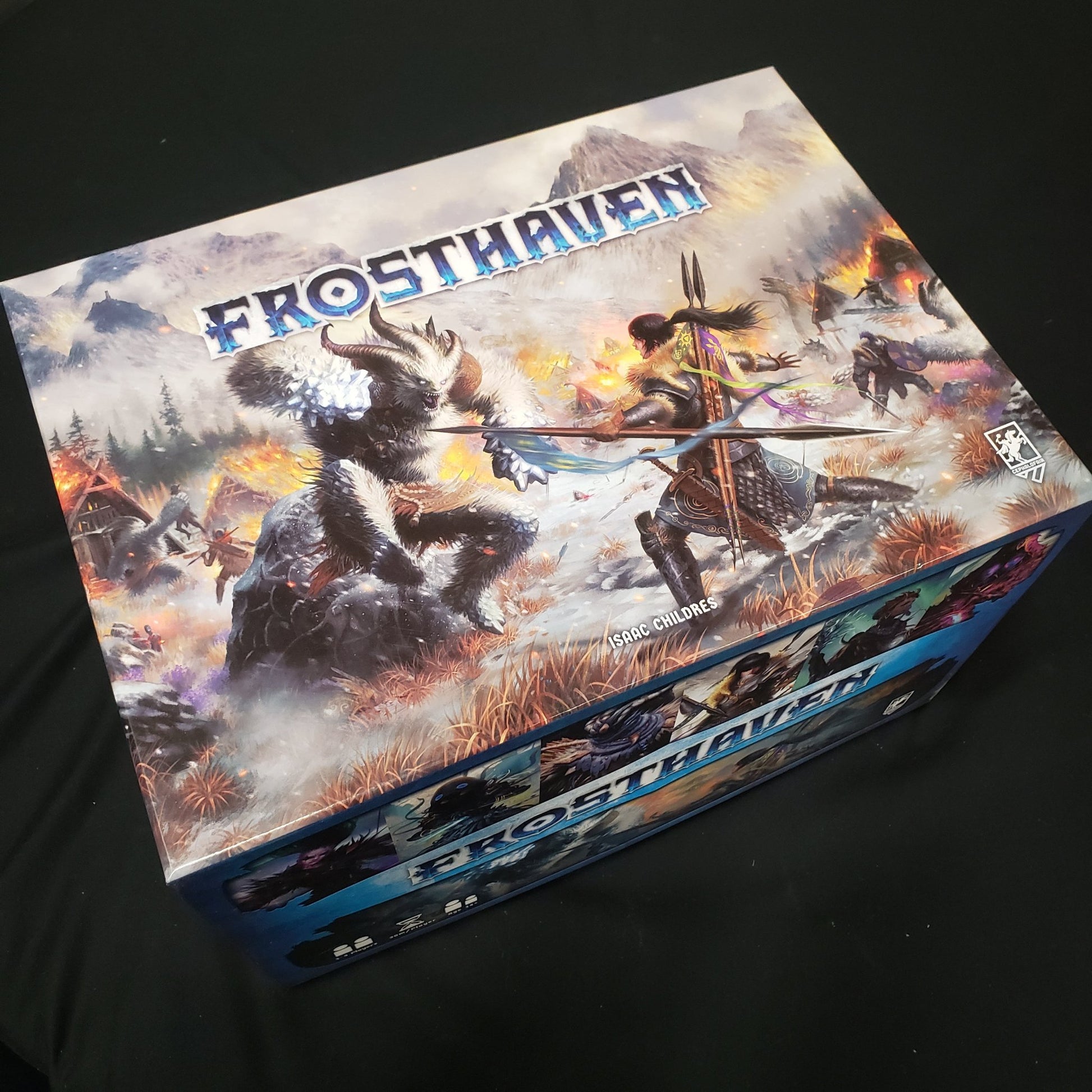 Image shows the front cover of the box of the Frosthaven board game