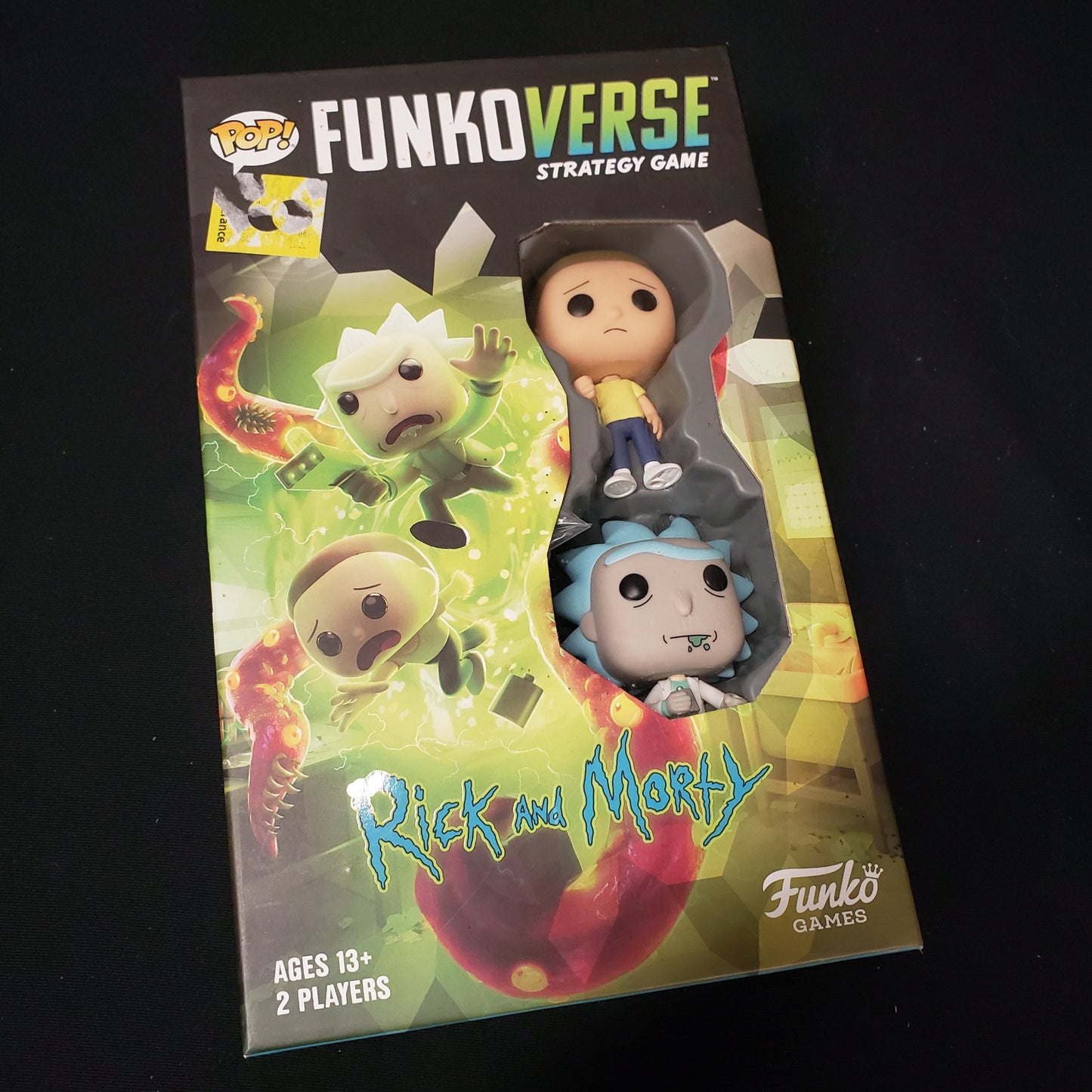 Image shows the front cover of the box of the Funkoverse: Rick & Morty board game