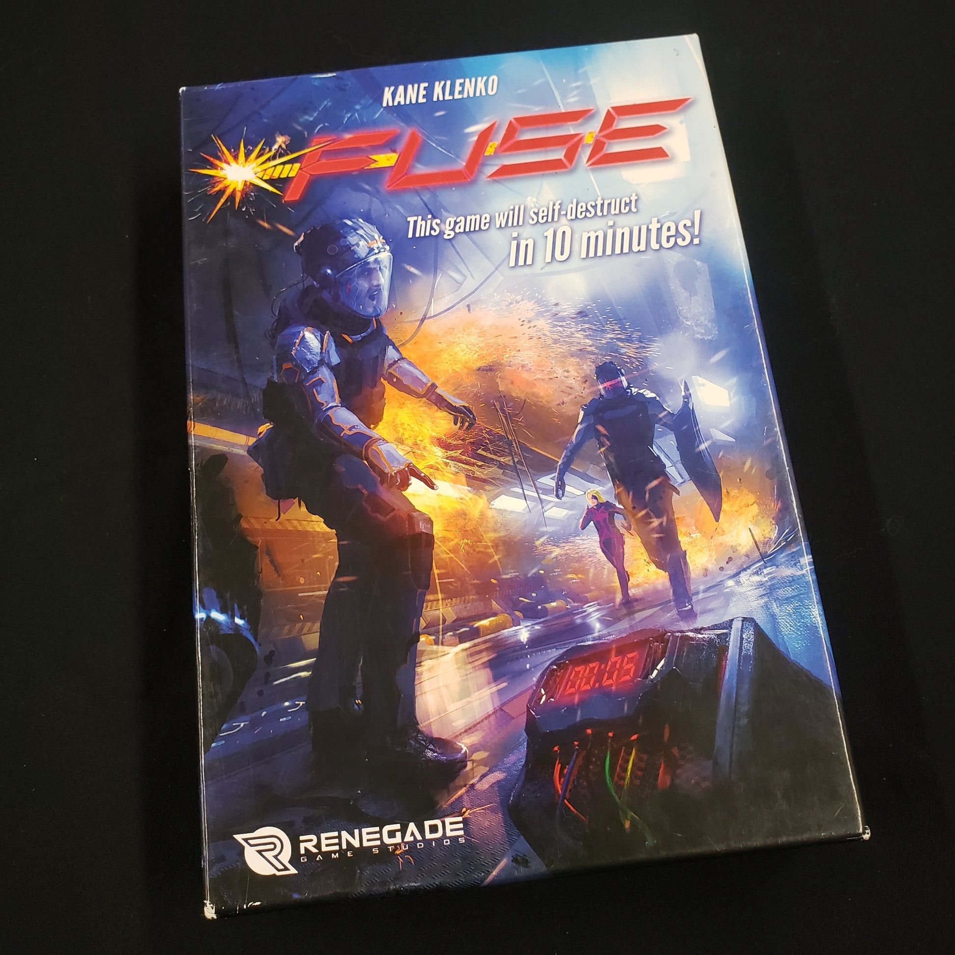 Image shows the front cover of the box of the FUSE board game