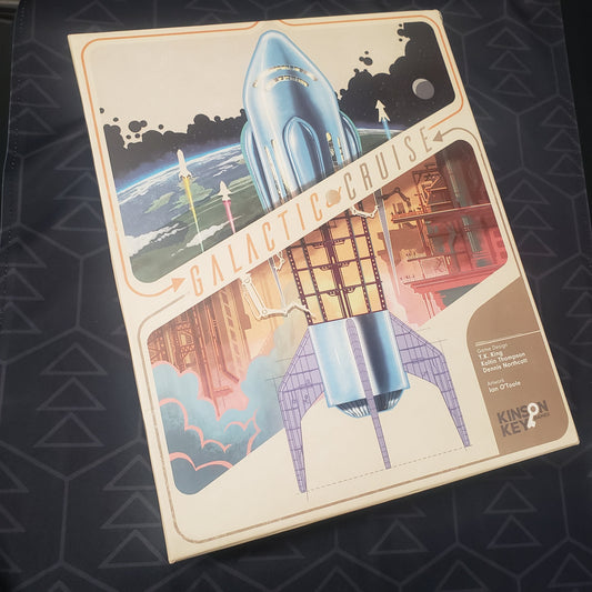 Image shows the front cover of the box for the Galactic Cruise board game