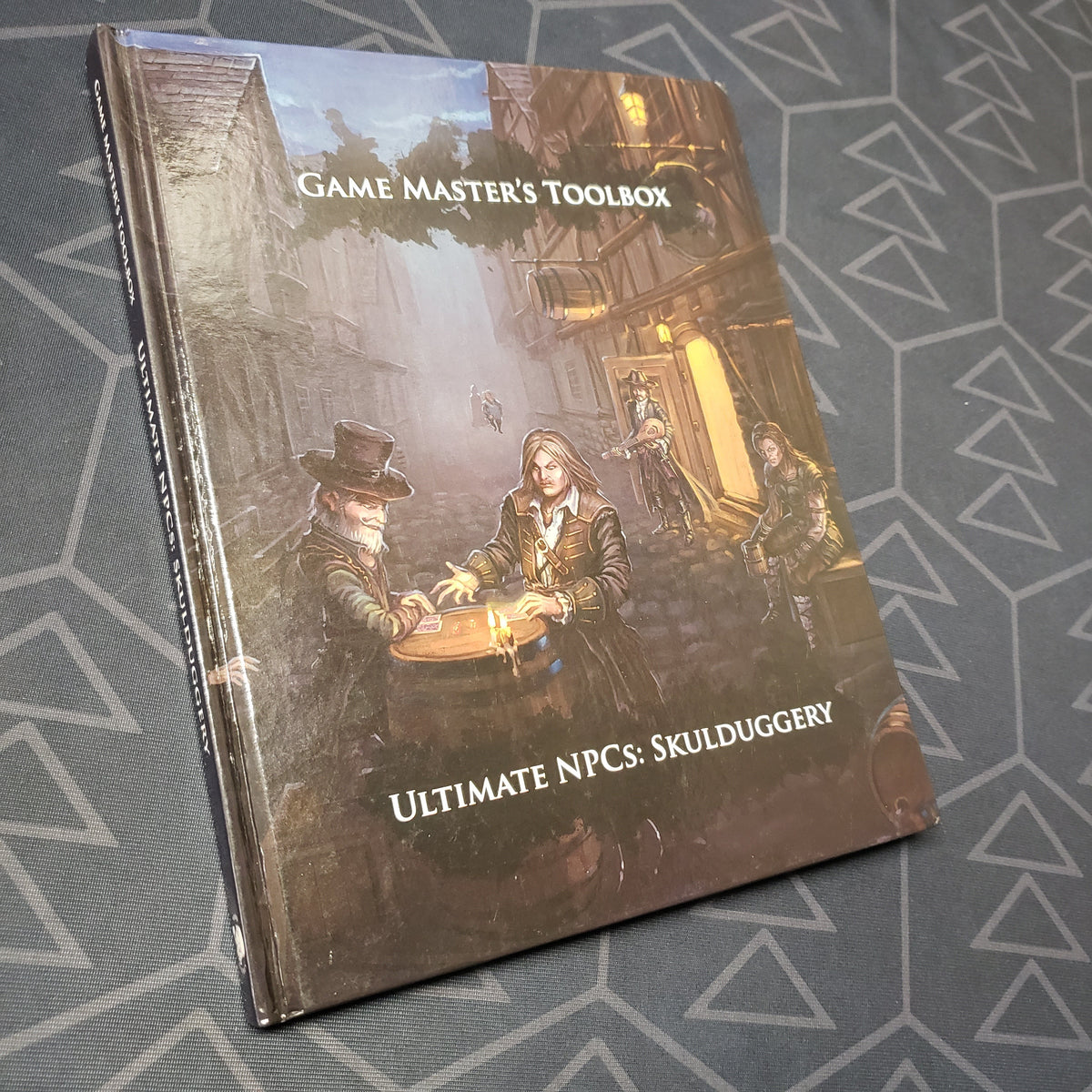 Image shows the front cover of the Game Master's Toolbox: Ultimate NPCs - Skulduggery roleplaying game book