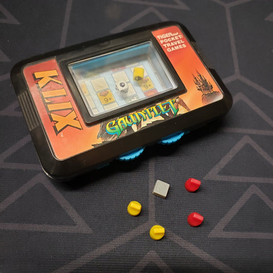 Image shows the front cover of the box for the Gauntlet KLIX travel board game