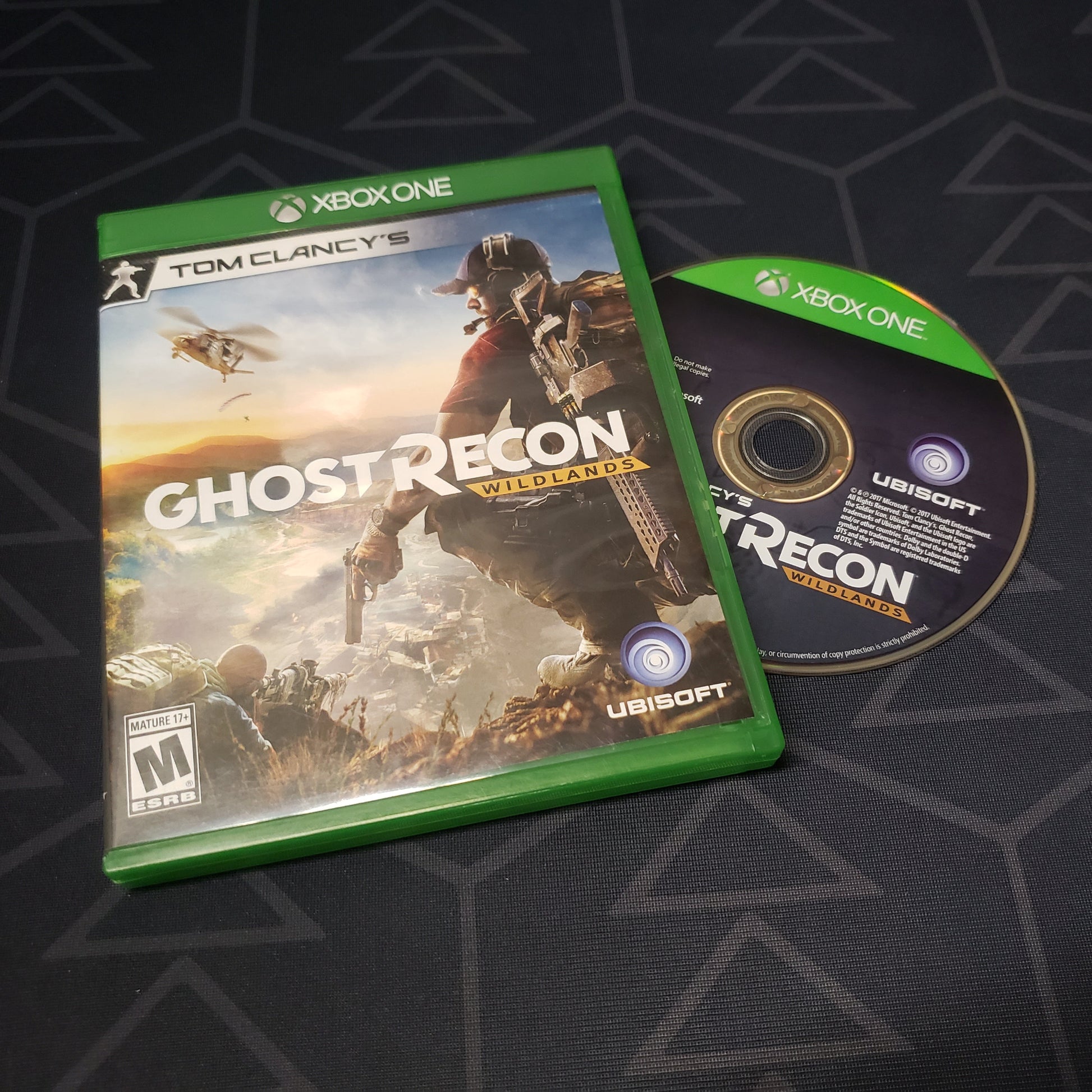 Image shows the case and disc for the video game Ghost Recon: Wildlands for Xbox One