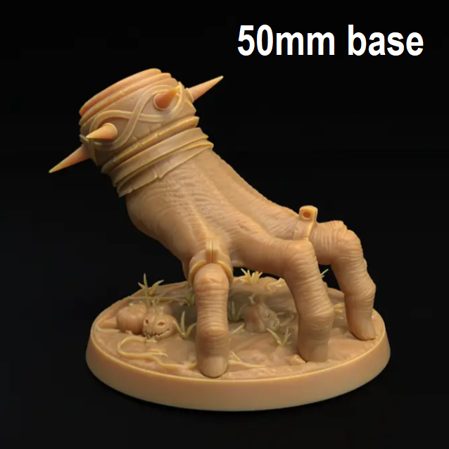 Image shows a 3D render or a monstrous crawling hand gaming miniature wearing a spiked bracelet