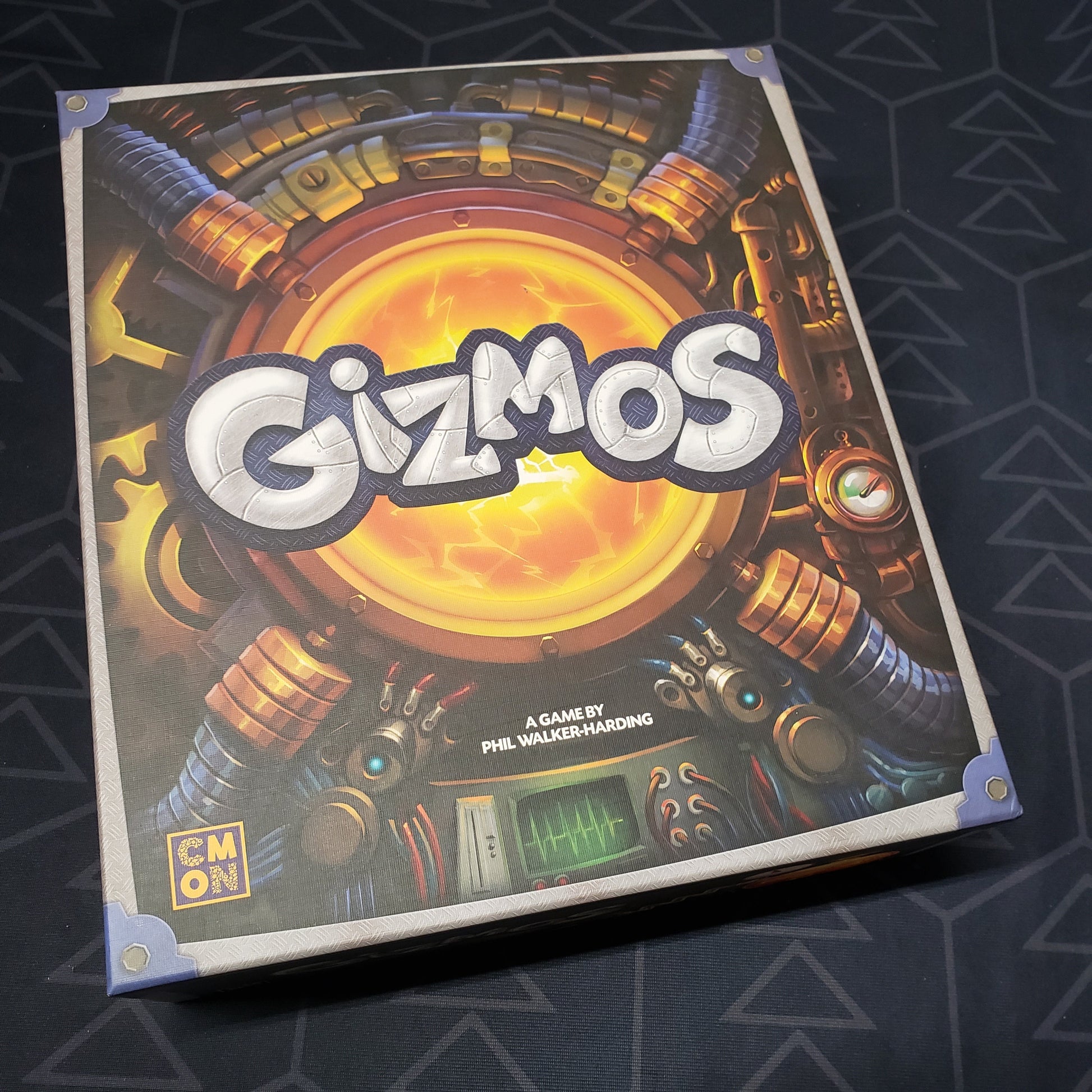Image shows the front cover of the box of the Gizmos board game
