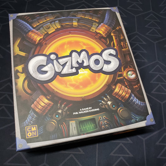 Image shows the front cover of the box of the Gizmos board game