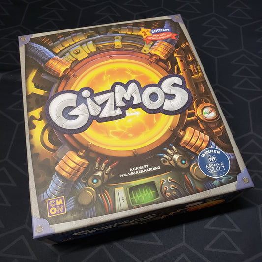 Image shows the front cover of the box of the Gizmos board game