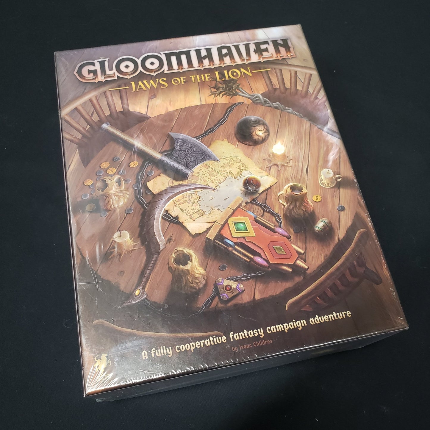 Image shows the front cover of the box of the Gloomhaven: Jaws of the Lion board game 