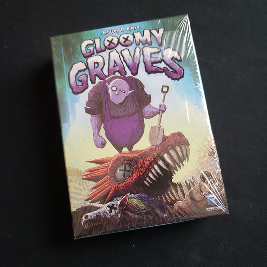 Image shows the front cover of the box of the Gloomy Graves board game