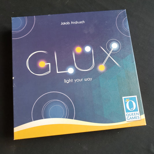 Image shows the front cover of the box of the Glux board game