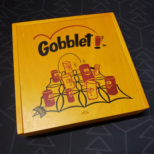 Image shows the front cover of the box for the Gobblet (Wood Box Edition) board game