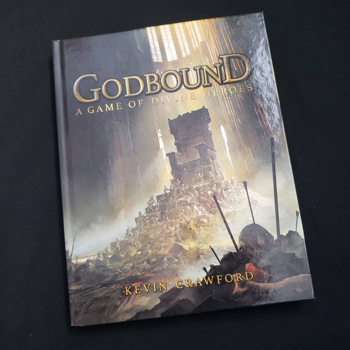 Image shows the front cover of the Godbound roleplaying game book