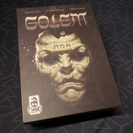 Image shows the front cover of the box of the Golem board game