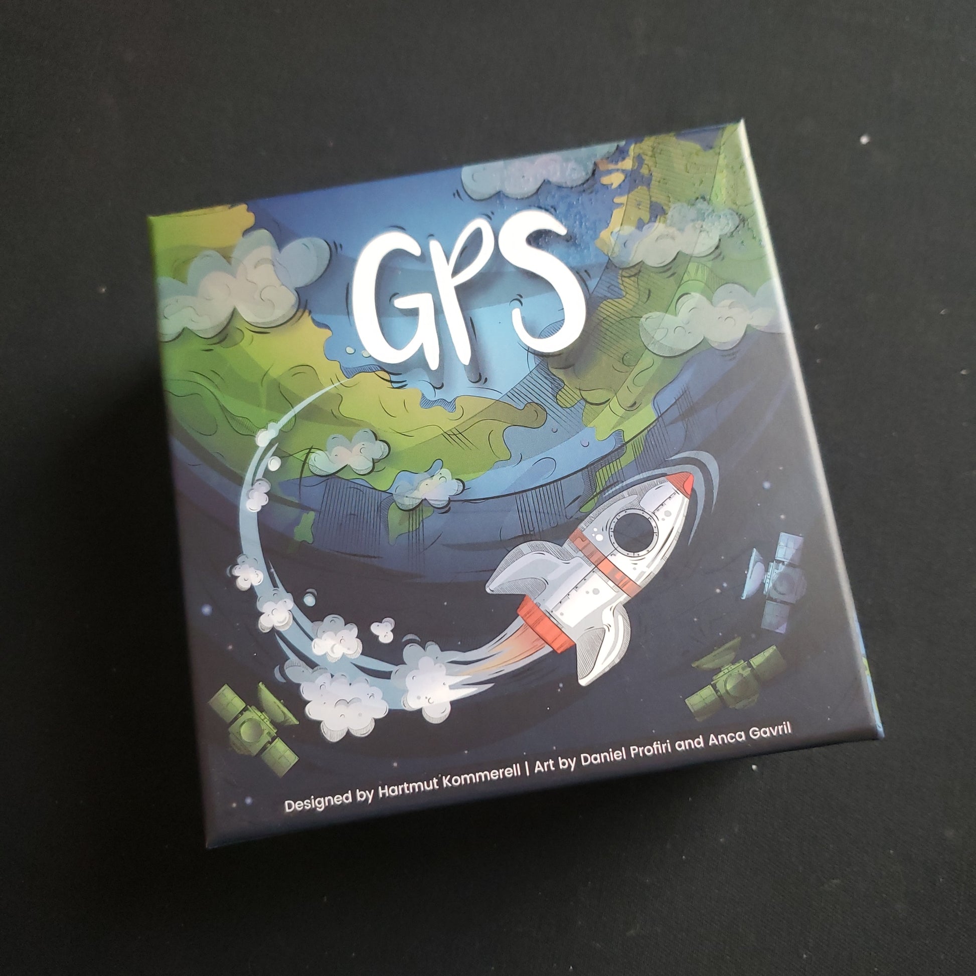 Image shows the front cover of the box of the GPS board game