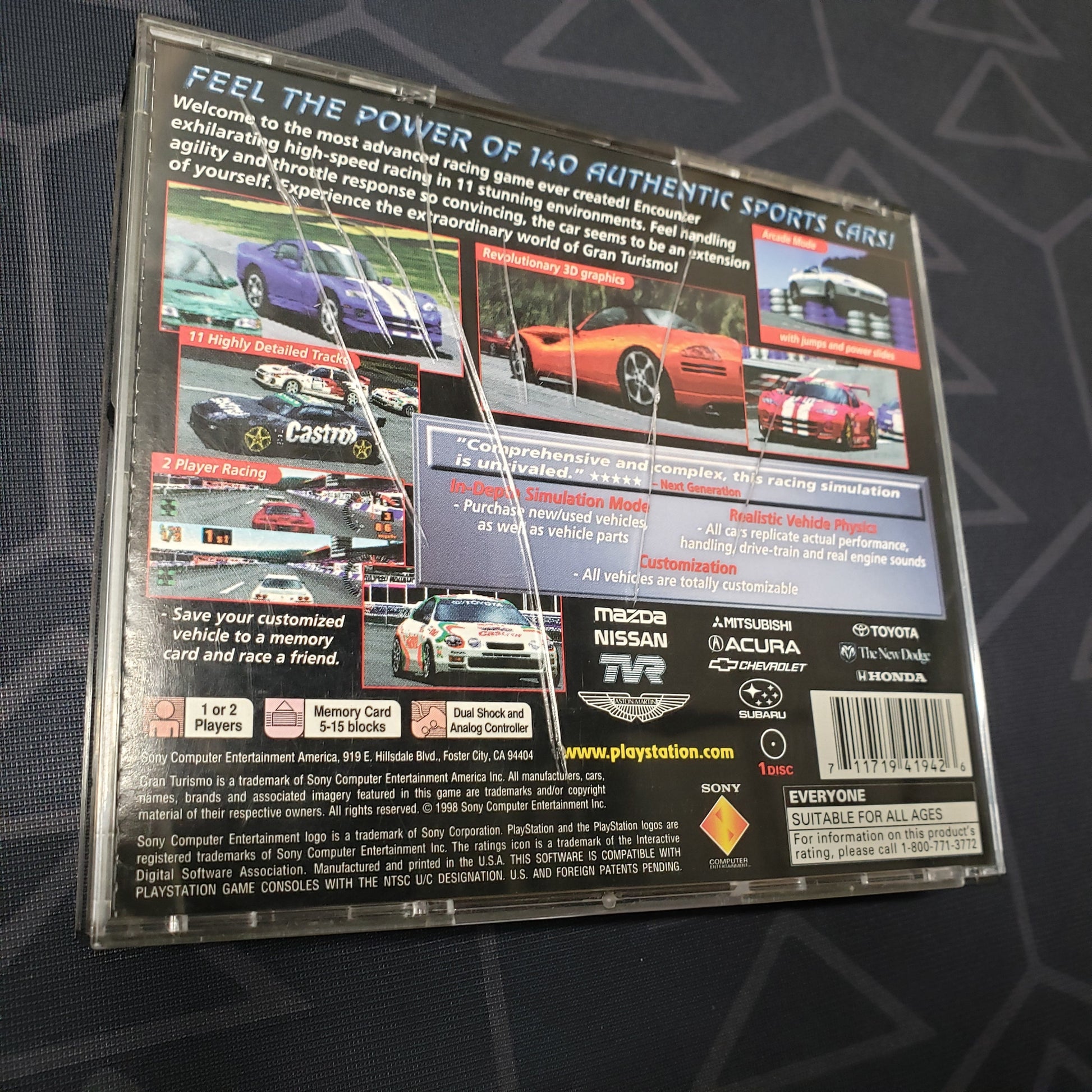 Image shows some cracks on the back of the jewel case for the video game Gran Turismo for Playstation 1