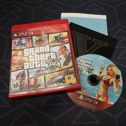 Image shows the case, manual and disc for the video game Grand Theft Auto V for Playstation 3