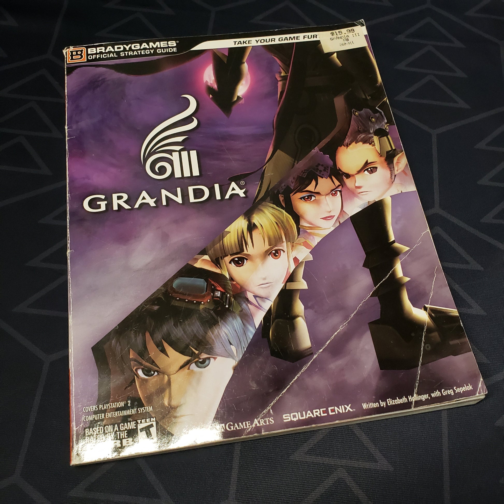 Image shows the front cover of the Grandia III strategy guide video game book