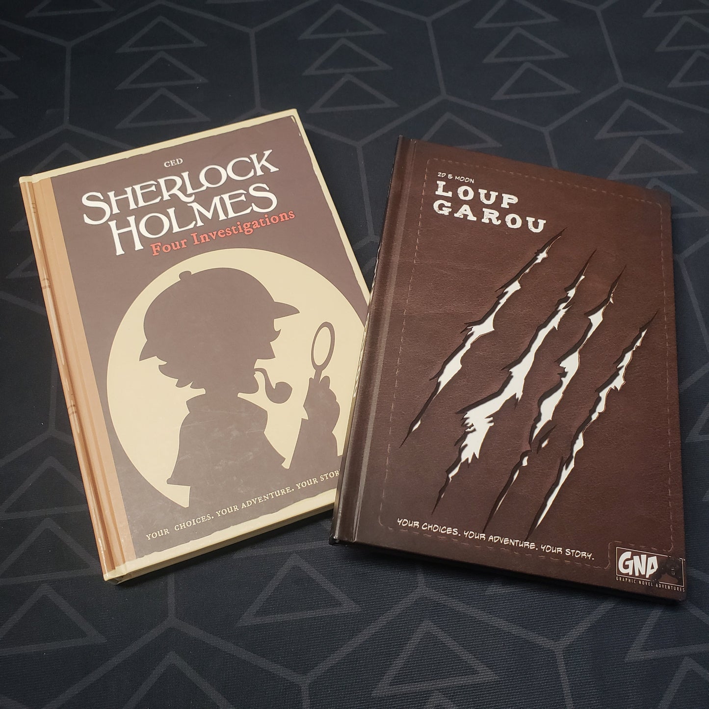 Image shows the covers of two of the books in the Graphic Novel Adventures: Season 1 gaming book box set