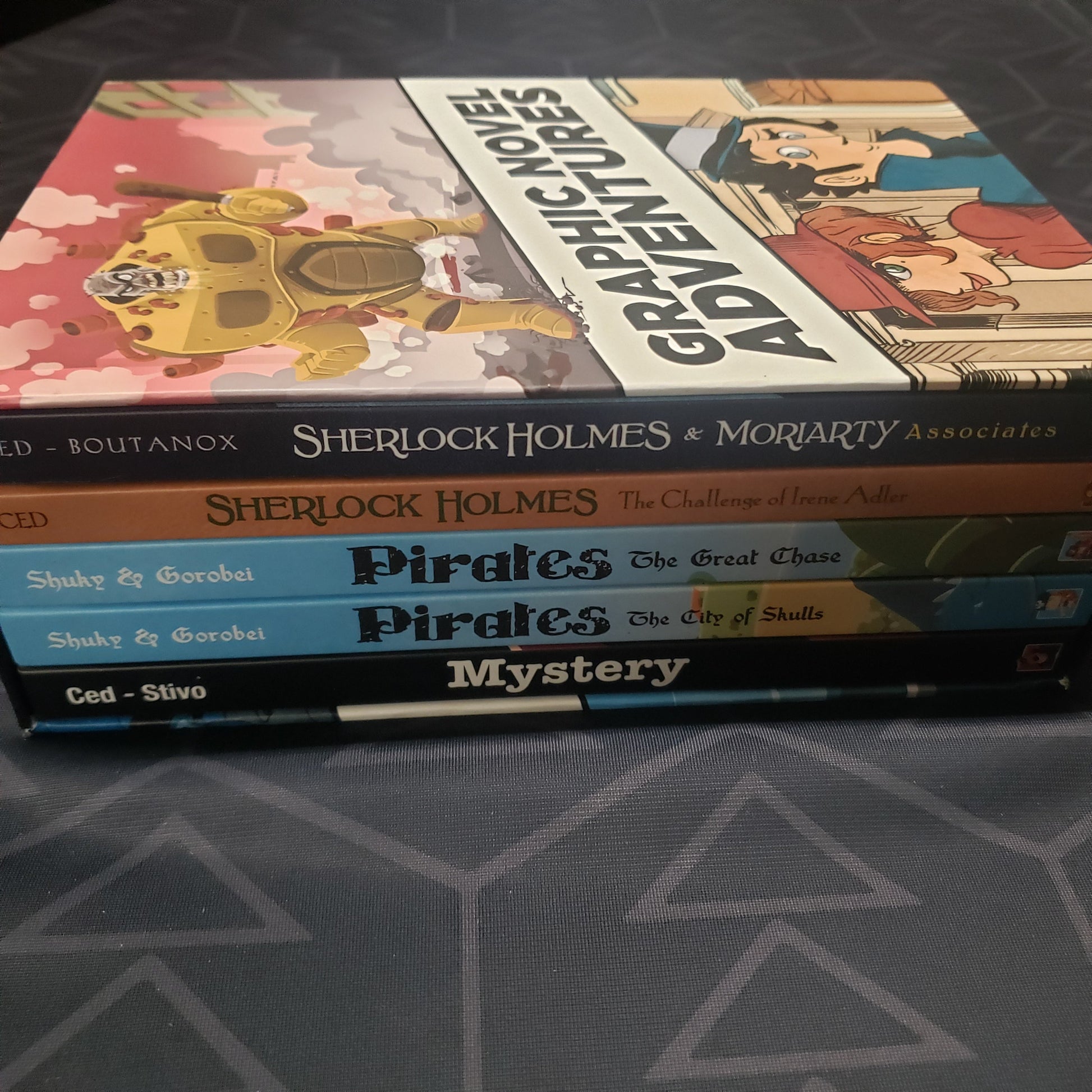 Image shows the spines of the five books in the Graphic Novel Adventures: Season 2 gaming book box set