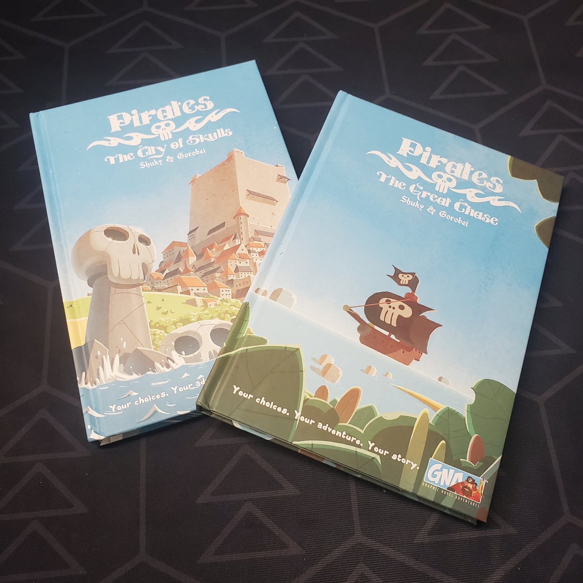 Image shows the covers of two of the books in the Graphic Novel Adventures: Season 2 gaming book box set